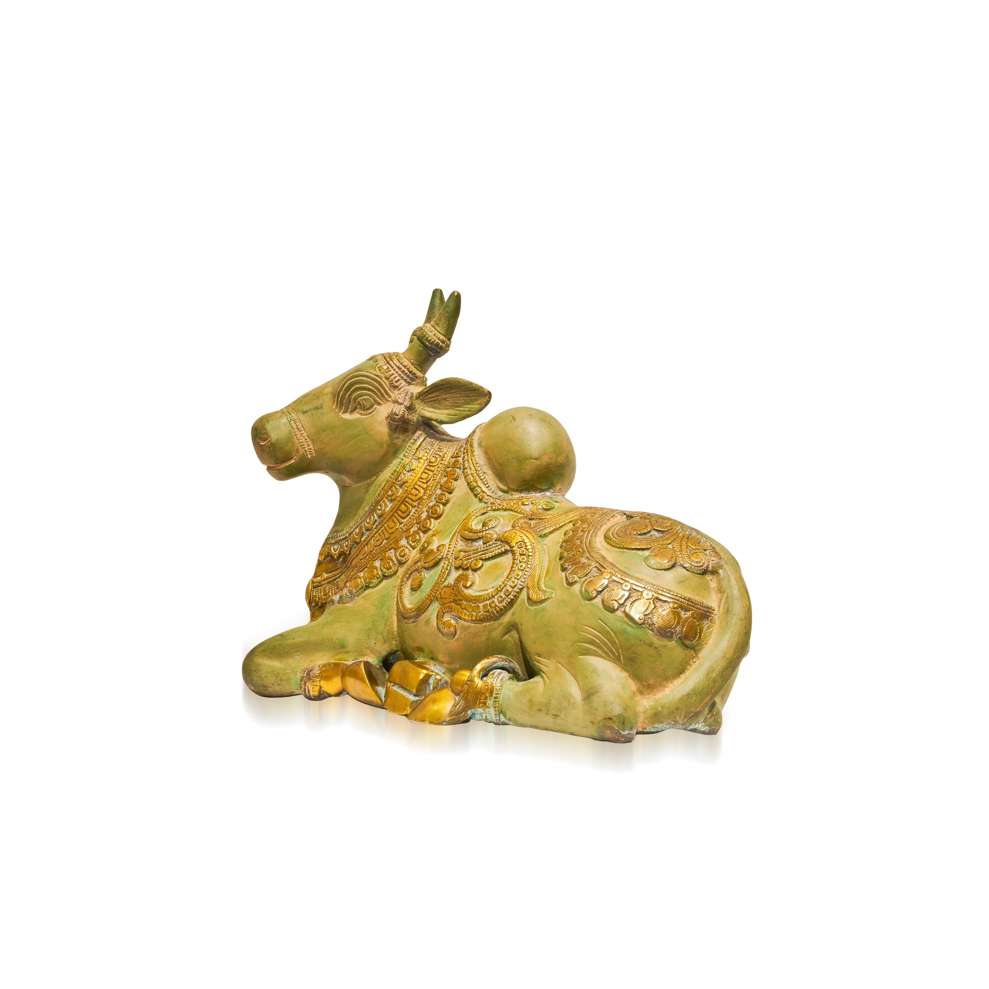 A small decorative figurine of a lying cow with ornate gold and yellow patterns on a muted olive-green glazed base, shown on a plain white background.
