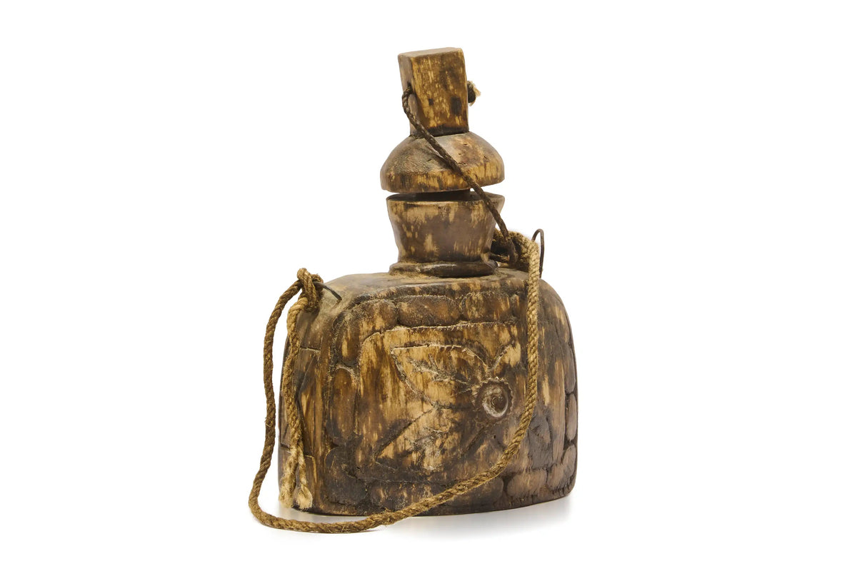 A vintage-style wooden canteen bottle with a matching wooden stopper and a thin wooden carrying strap, shown on a plain white background.